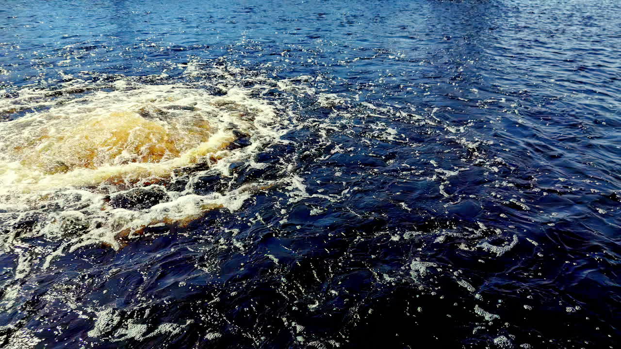 low-angle perspective of the colossal Nord Stream pipeline methane leak in the Central Baltic Sea during a turbulent Autumn 2022 day captured with a standard-to-wide-angle lens