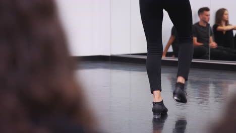 Close-Up-Of-Female-Tap-Dance-Student-Performing-For-Class-In-Studio-At-performing-Art-School