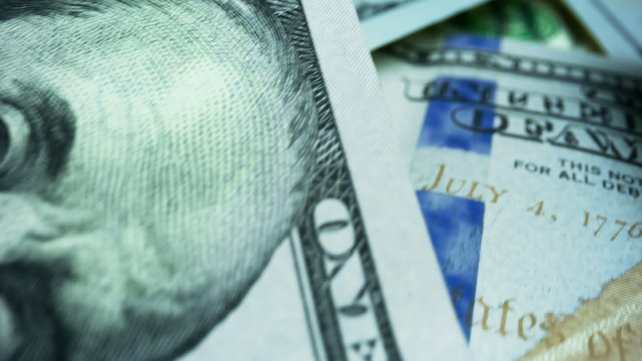 dinero en efectivo estadounidense. vista detallada de billetes de cien dólares de fondo