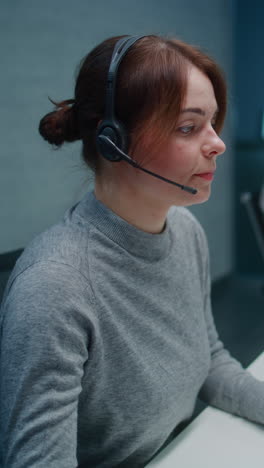 woman wearing headphones in call center