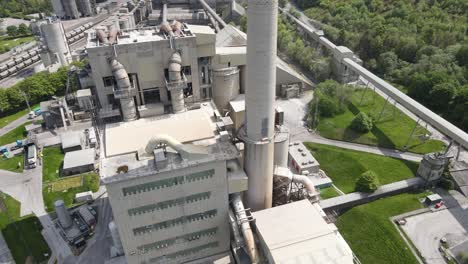 aerial drone flight around the main building of breedon hope cement works facility in derbyshire