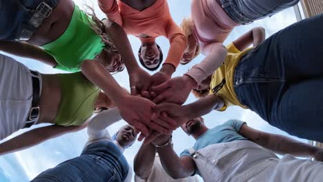 Diverse Group of Friends Stacking Hands in Unity