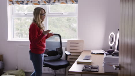 woman in home office talking