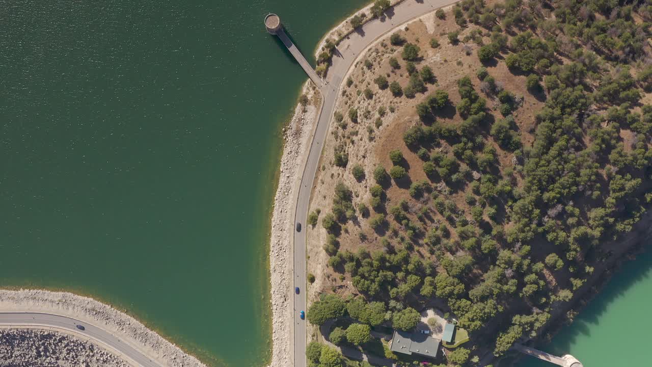 Aerial View of a Dam and Lake with Road