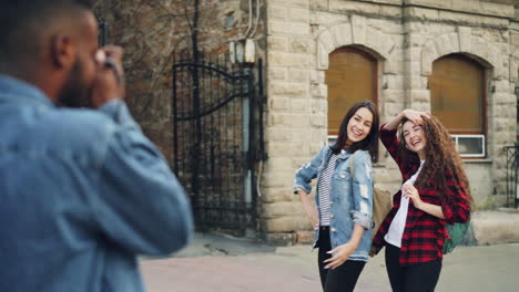 friends taking pictures on the street