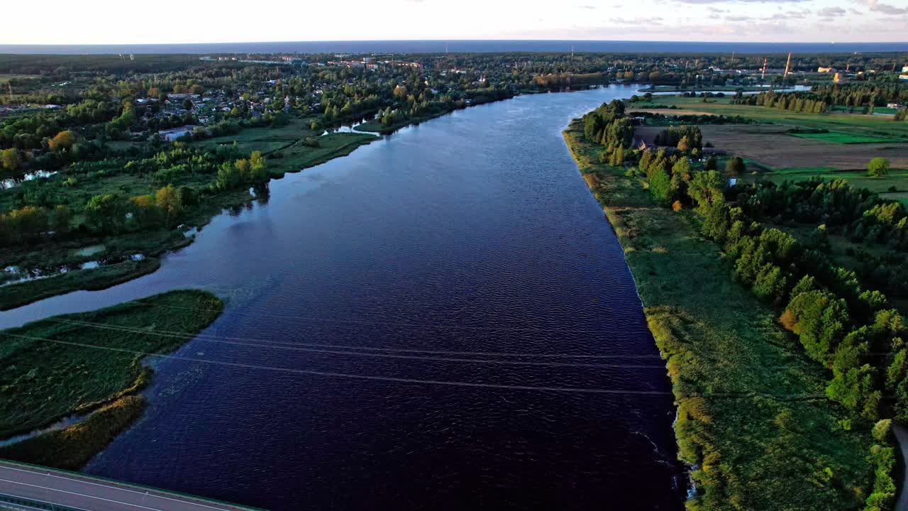 Beautiful aerial view of the river and landscape in Latvia during sunset