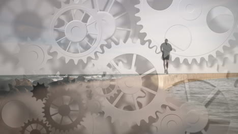 animation of cogs spinning over fit man running