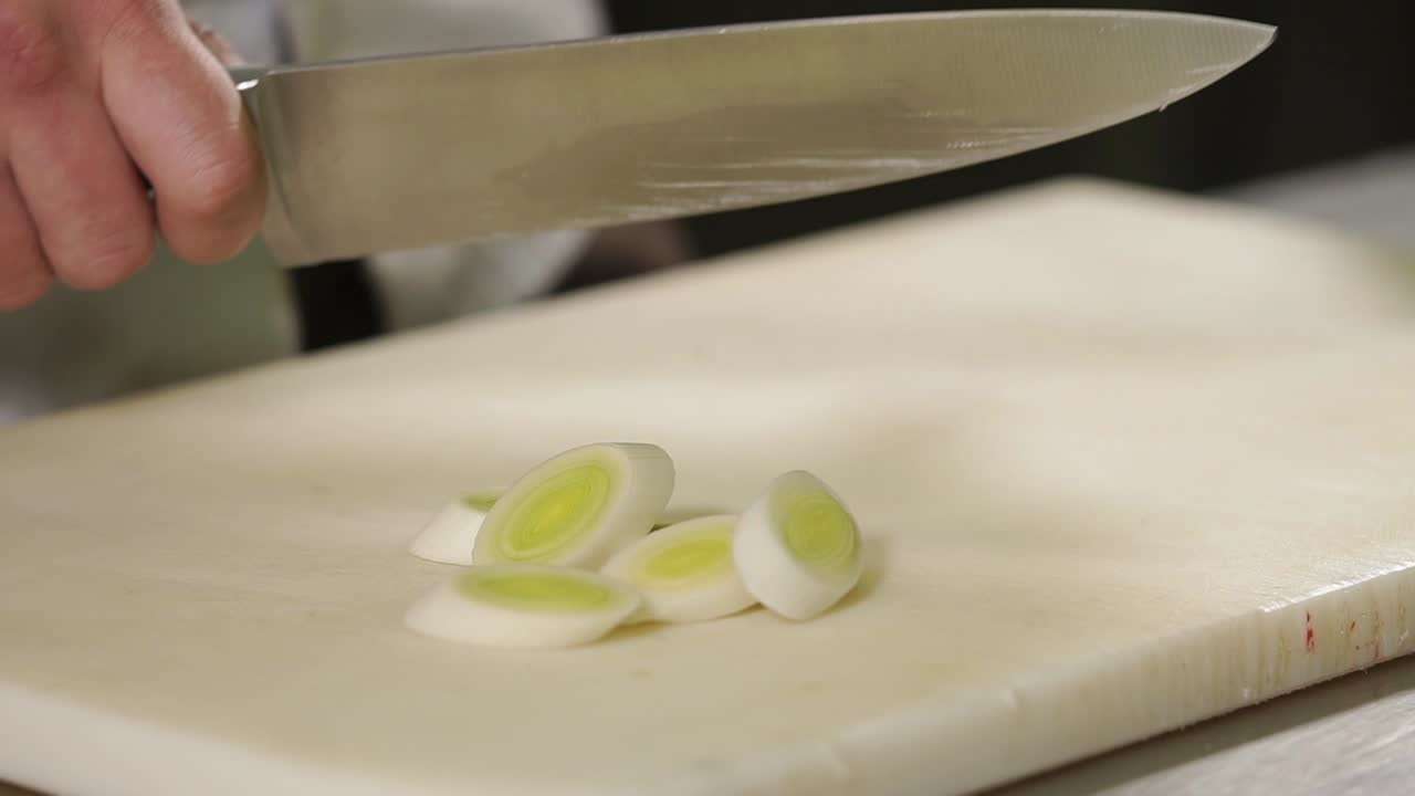 Chef Chopping Leeks and Red Bell Pepper