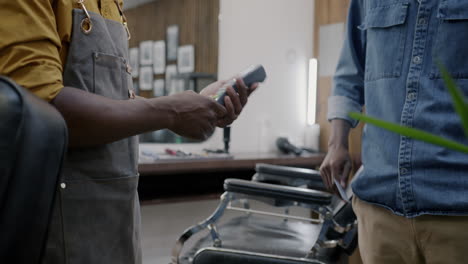 payment and handshake in barber shop