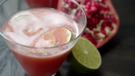 shot-of-pomegranate-cocktail-Making-a-pomegranate-cocktail-using-fresh-pomegranate-juice-and-seeds-rum-lime-syrup-and-fresh-ingredients