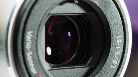 close-up of vintage video-camera. close and open lens zoom of camera. using portable camcorder to shooting videos