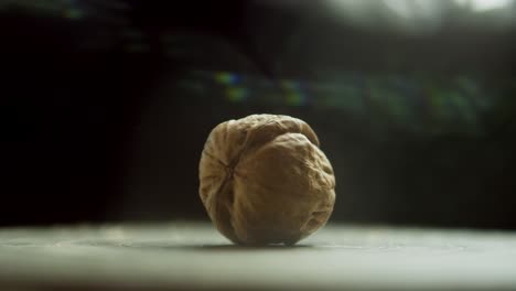 a nut on a spinning surface explodes when hit with a sledgehammer