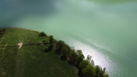 drone shot with turquoise water at mountain in the spring