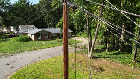damaged utility pole power lines drone slow rise