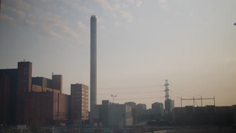 Timelapse-of-Suvilahti-Power-Plant-going-from-midday-to-nighttime