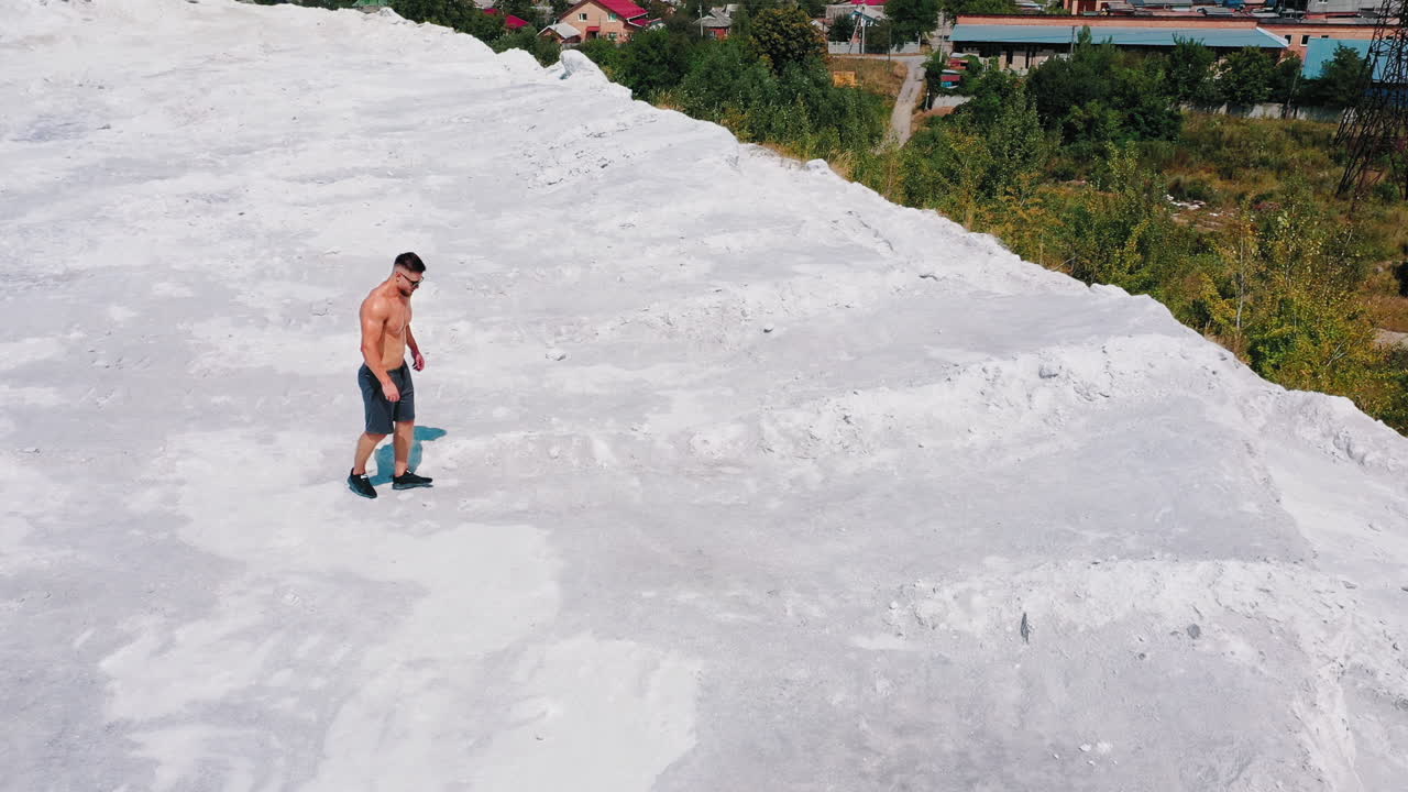 Aerial view of a muscular sexy man. Bodybuilding and outdoor sports concept