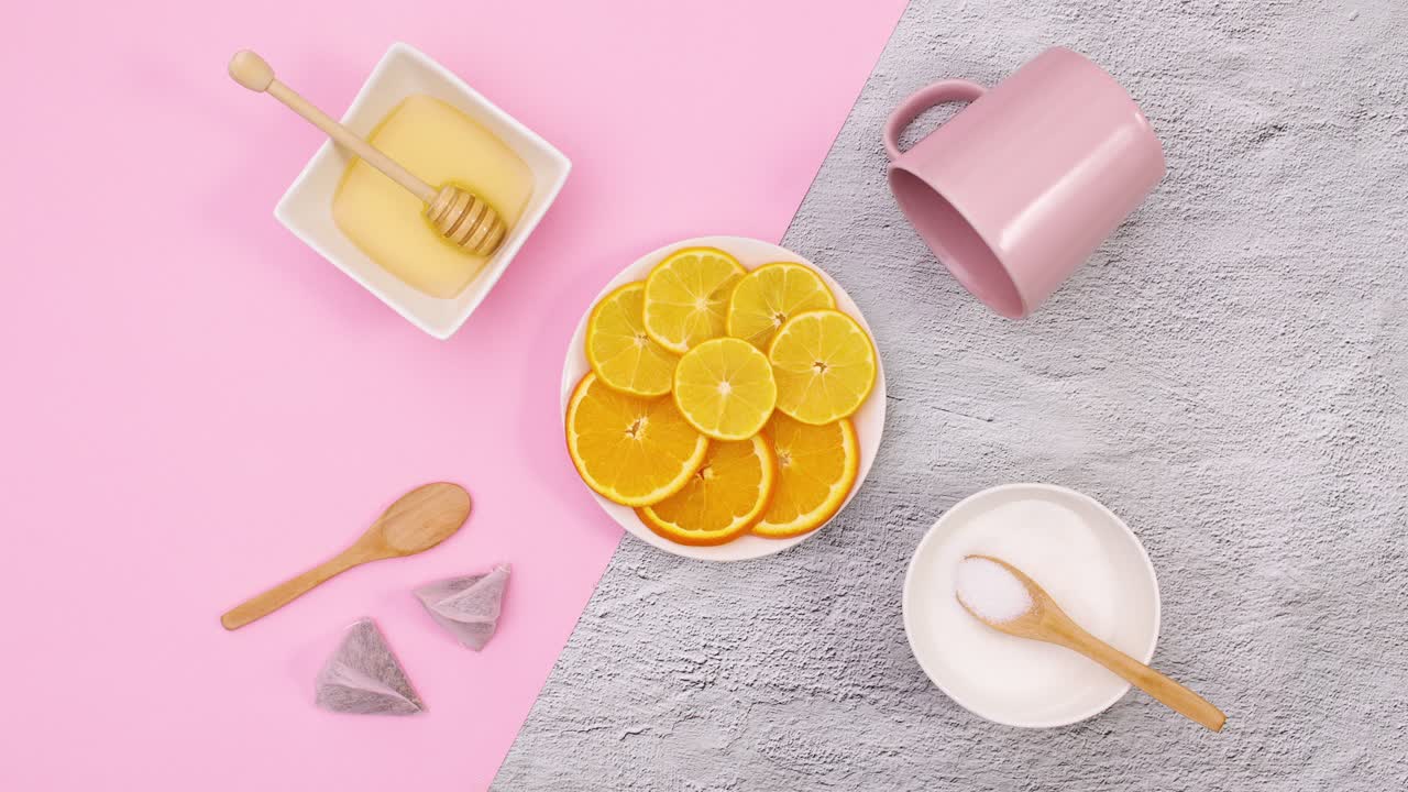 Sliced lemons move in circle and supplies for making tea move around. Stop motion