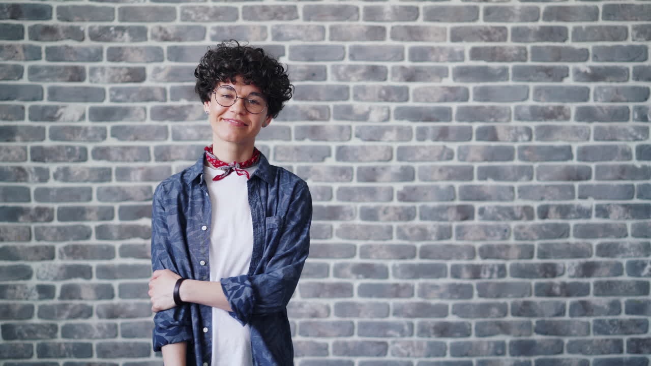 Woman Portrait against Brick Wall