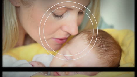 animation of moving screens and geometrical shapes over caucasian mother kissing baby