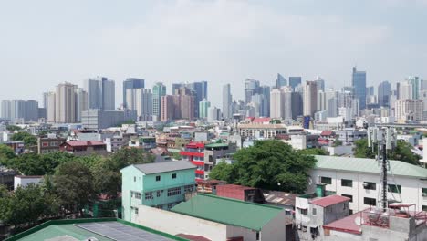 manila skyline: a stunning contrast of modern highrises and traditional houses