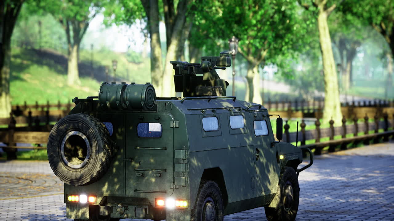 Military vehicle parked in a sunny park surrounded by lush greenery