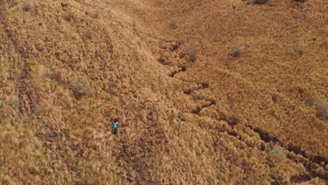 Two-hikers-walking-on-Casahuala-Mountain-in-Ecuador,-South-America