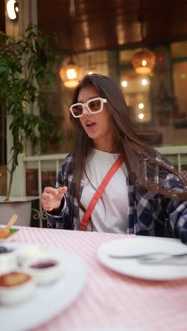 woman enjoying a meal at an outdoor cafe