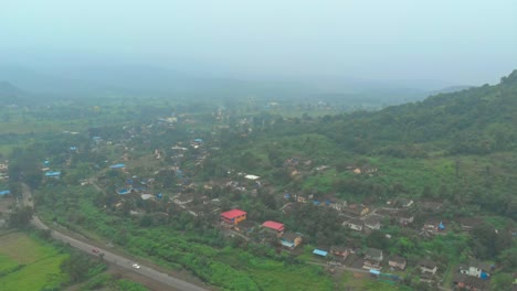 rotating-drone-shot-over-rural-Indian-village-on-hillside