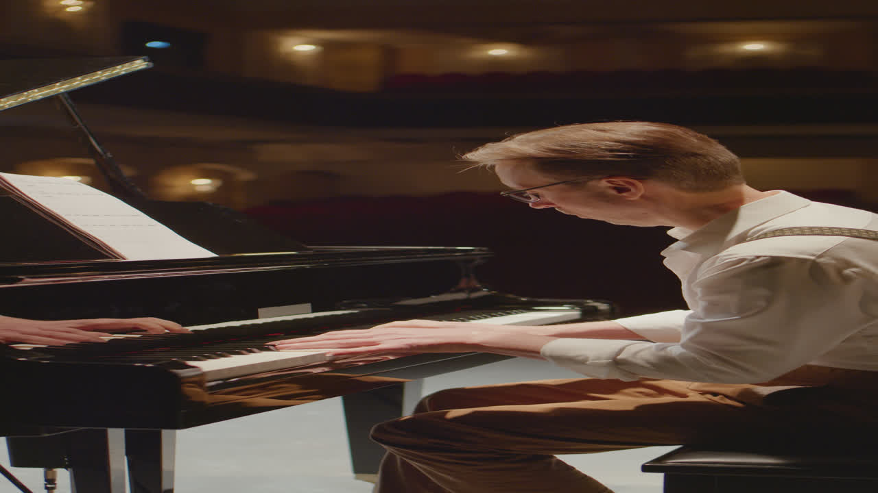 Vertical Shot of Pianist Playing Music on Stage