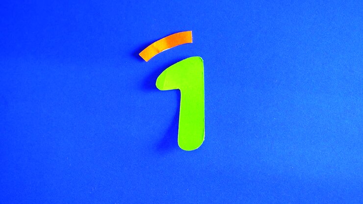 Green Letter B with Orange Circle on Blue Background