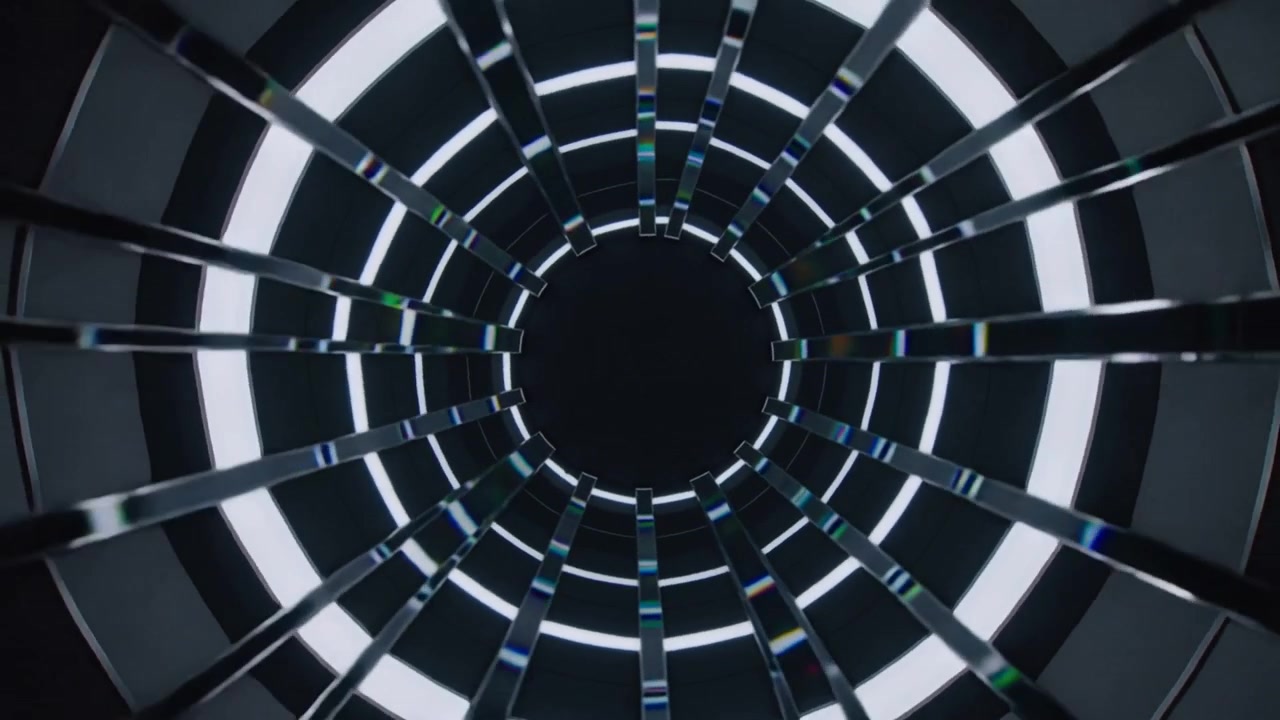 Moving camera causing tunnel in rig rotating and closing showing lit rings spectral slats dark void