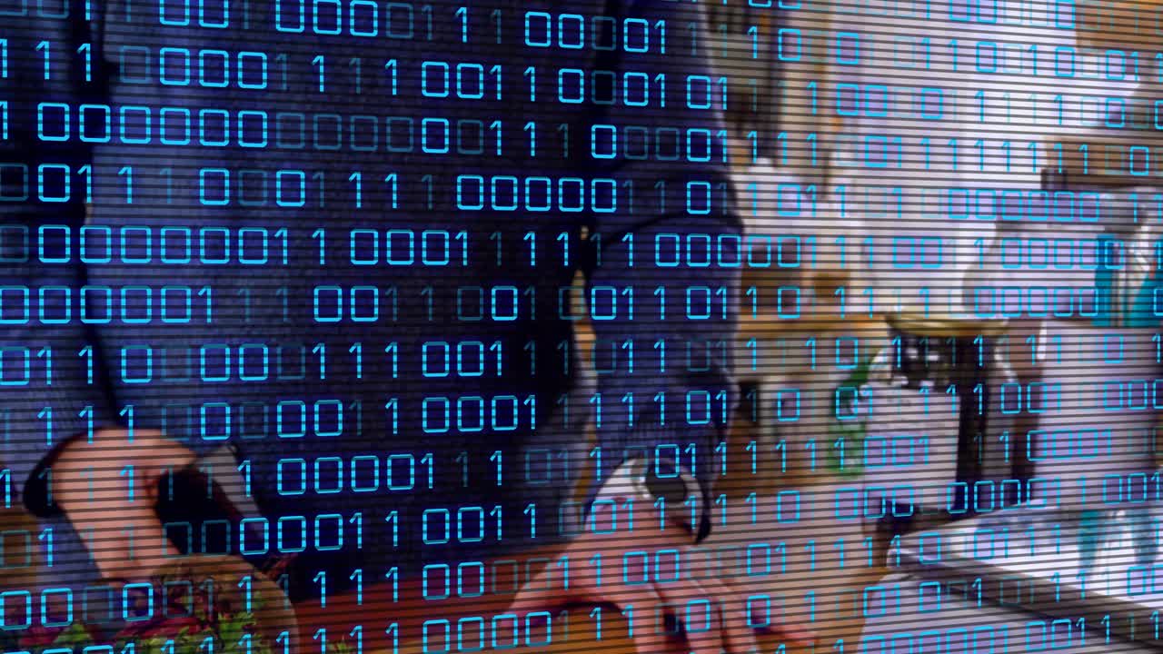 Camera framing kitchen counter, two men chopping and plating veg for demo under blue binary overlay