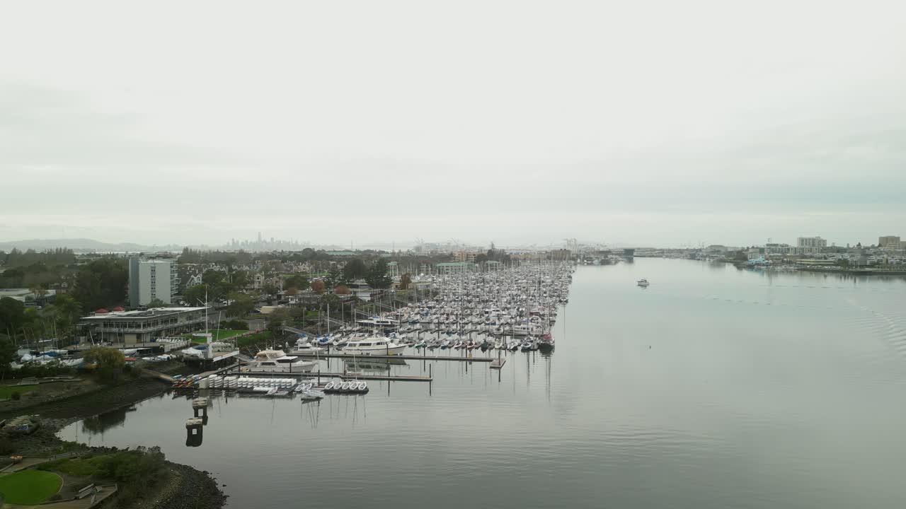 Drone view of Mariner Square’s docks and boats in Alameda, offering a peaceful glimpse of California’s coastal life.