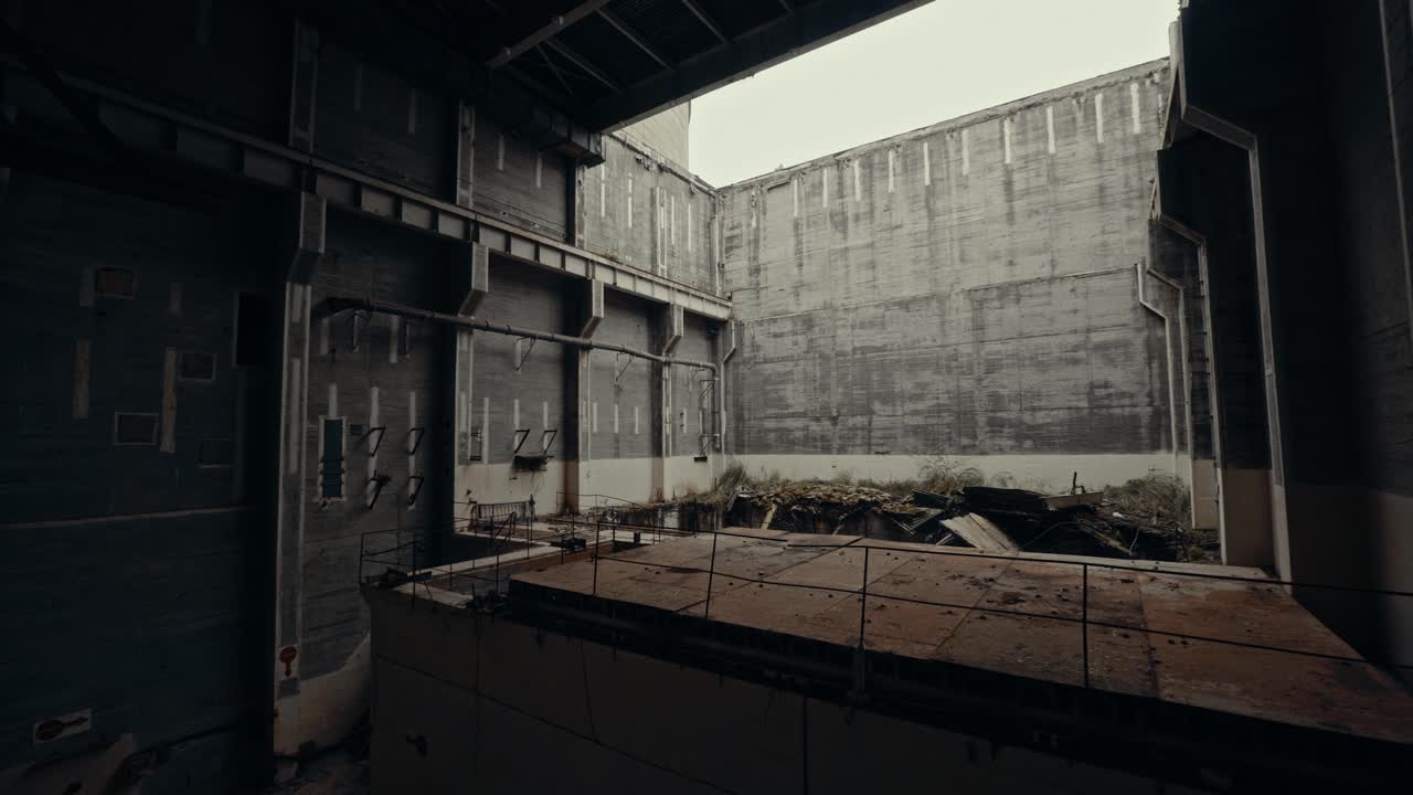 Abandoned Industrial Building Interior with Concrete Walls and Debris