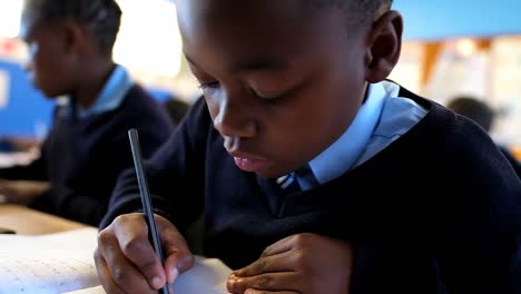 schoolboy studying in the classroom at school 4k