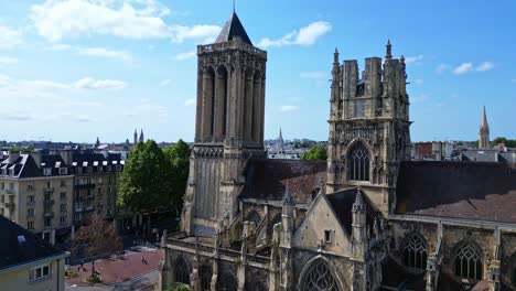 dramatically upward aerial movement from the church of saint jean entrance, caen, france