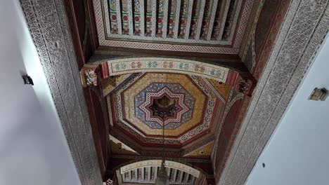 artistic design ceiling inside riad home in medina of marrakesh, morocco