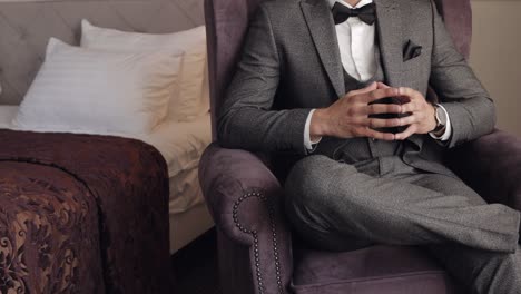 man put on wrist watch, groom dresses, male businessman waiting for meeting, hand with clock