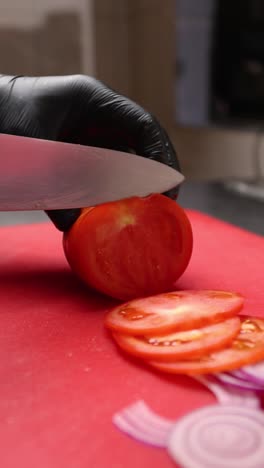 chef slicing tomatoes