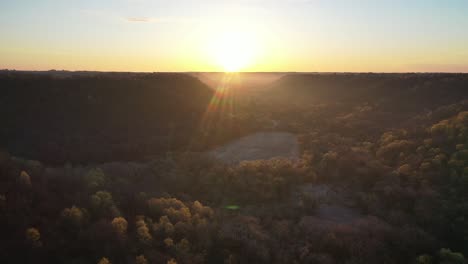 sunrise over a forest valley