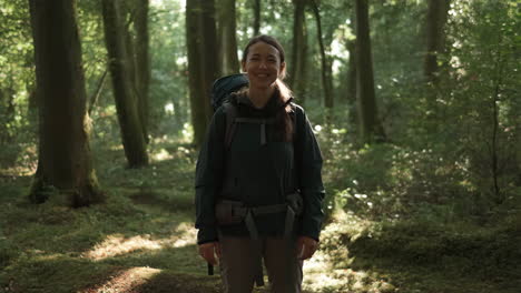 Woman Backpacking in Forest