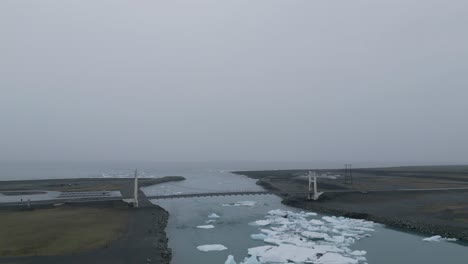 bridge over the jokulsarlon glacial lagoon near the diamond beach in iceland