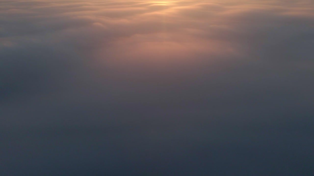 Aerial view of serene sunrise over clouds, Piaam, Friesland, Netherlands