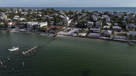 fishing boat near a damaged public dock on anna maria island, interior side channel