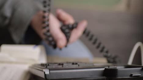 holding phone wire while having a conversation from desk phone