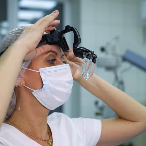 surgeon preparing operation on eyes