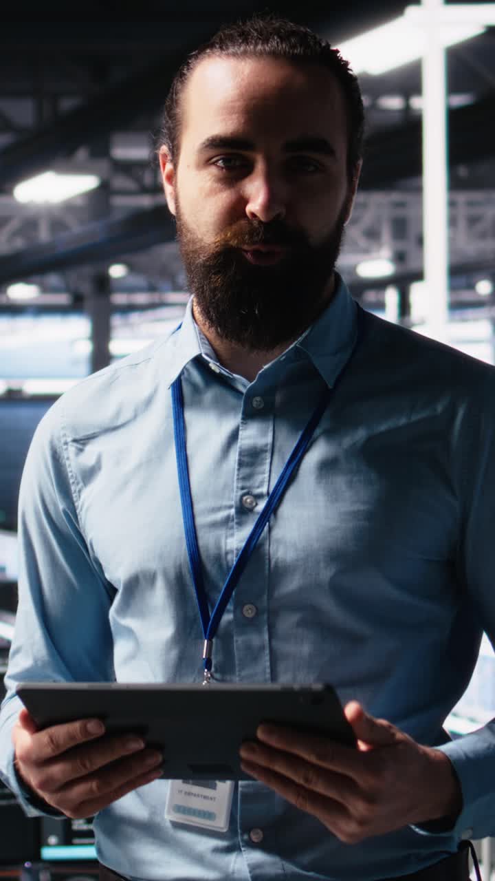 Vertical video Data center lead programmer showcasing AI technology and rigs