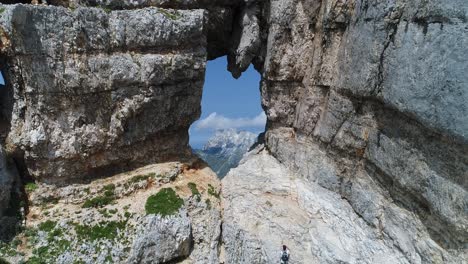 aerial drone shot of a mountain scenery with a hole, 4k uhd