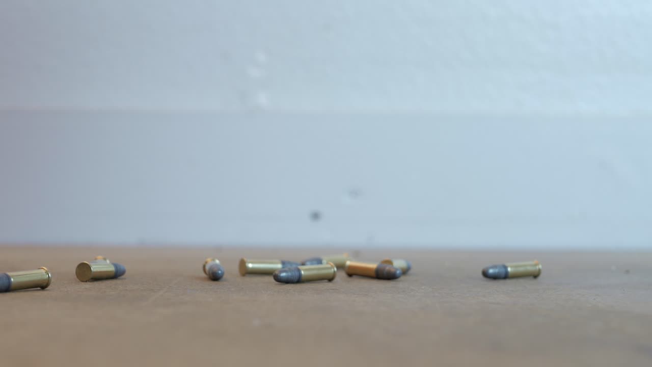 bullets falling onto a table 22 caliber