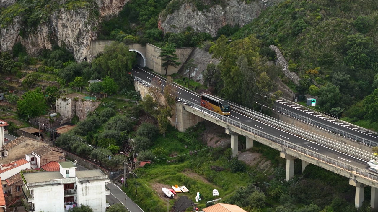 Scenic Sant'Alessio Castle with greenery, serene mood, aerial view